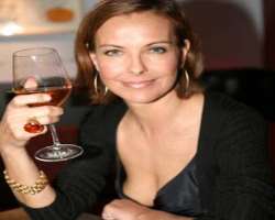Carole Bouquet consuming alcohol